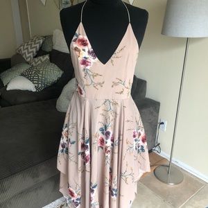 Woman’s dress, asymmetrical, cross back straps, size 4